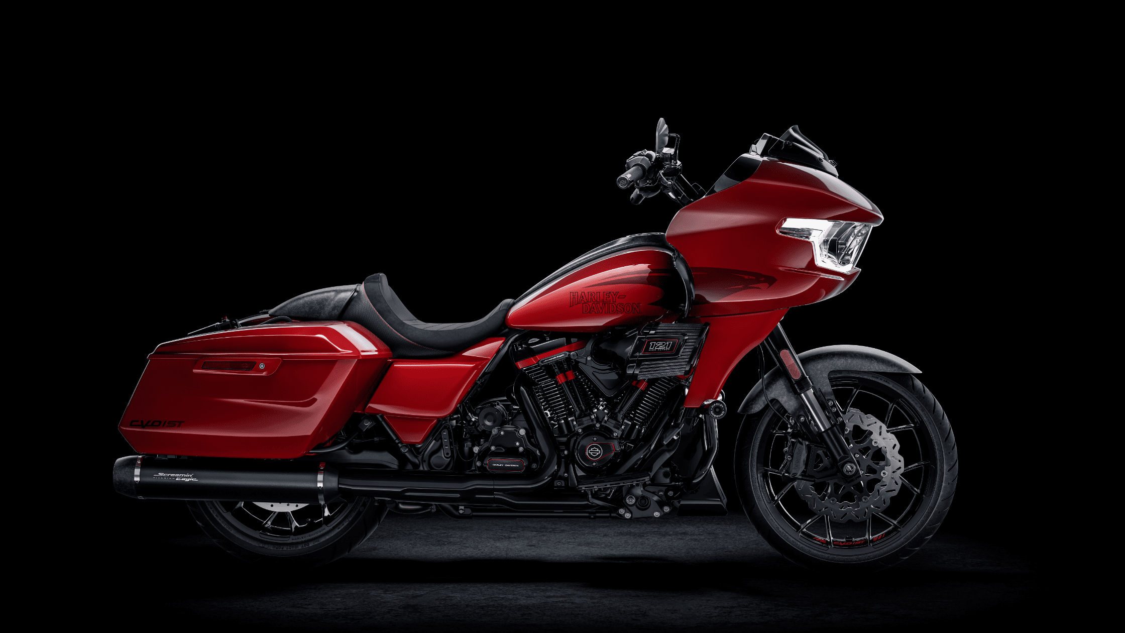 Red 2025 Harley-Davidson CVO Road Glide ST motorcycle with blacked-out engine and details