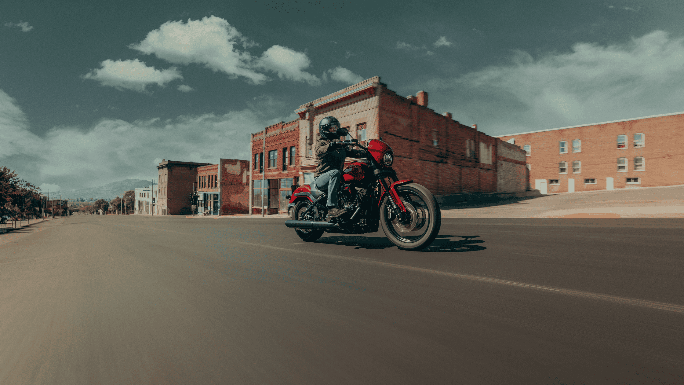 2025 Harley-Davidson Low Rider S red motorcycle, rider on urban street in Augusta, GA