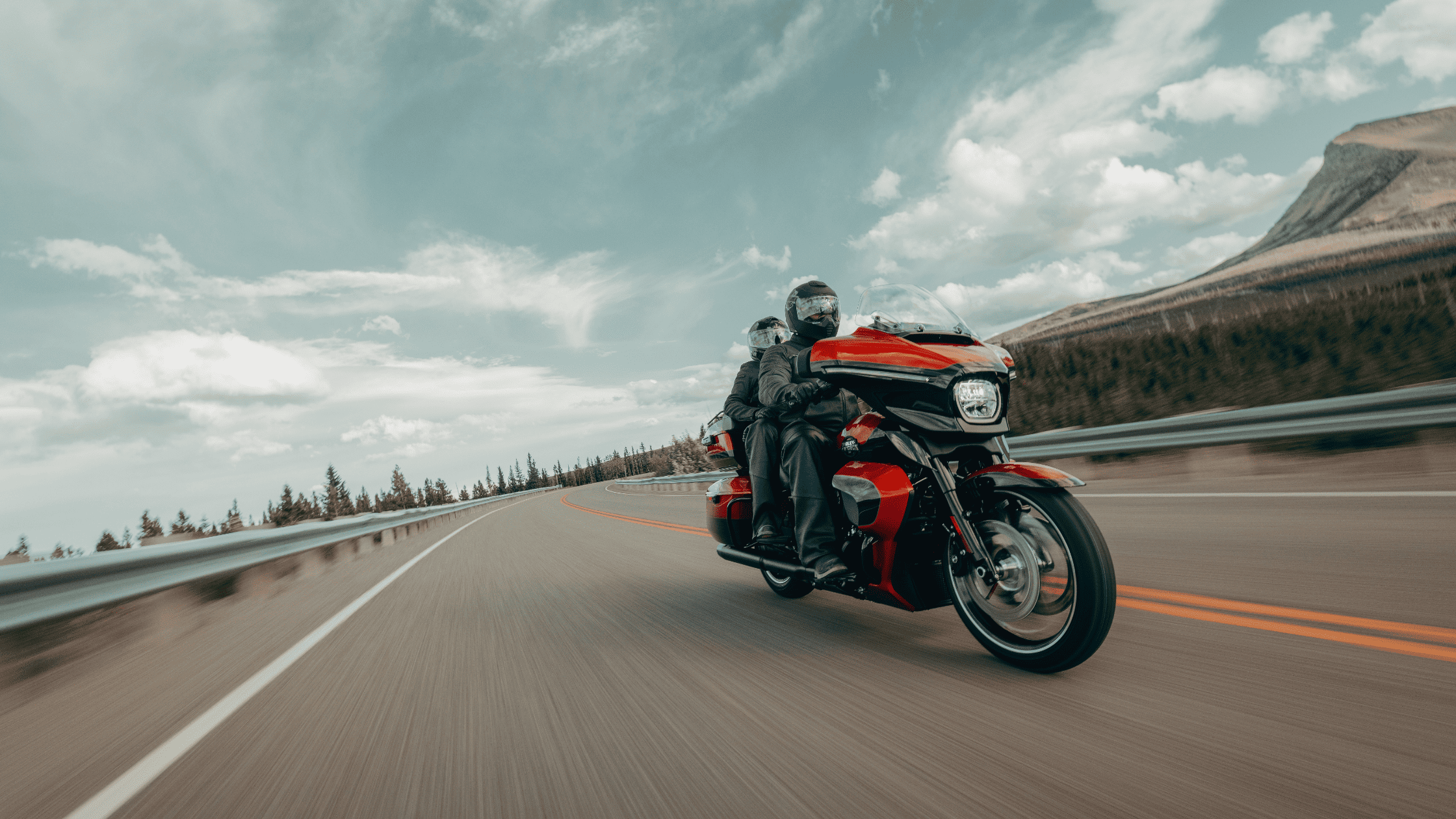 The 2025 Harley-Davidson® Street Glide® Ultra in a bold red finish, designed for long-distance touring with style and power