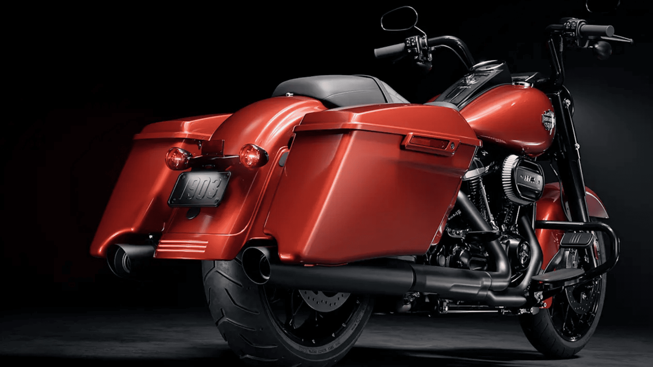 A striking red 2025 Harley-Davidson® Road King® Special showcasing its rear and sleek saddlebags und…
